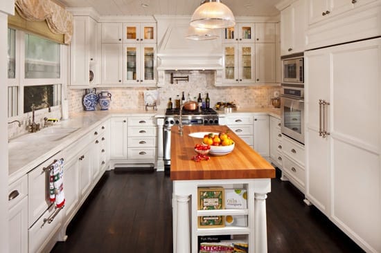White kitchen with wood floors and center island